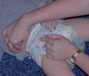 Pull on the corner of the cover.